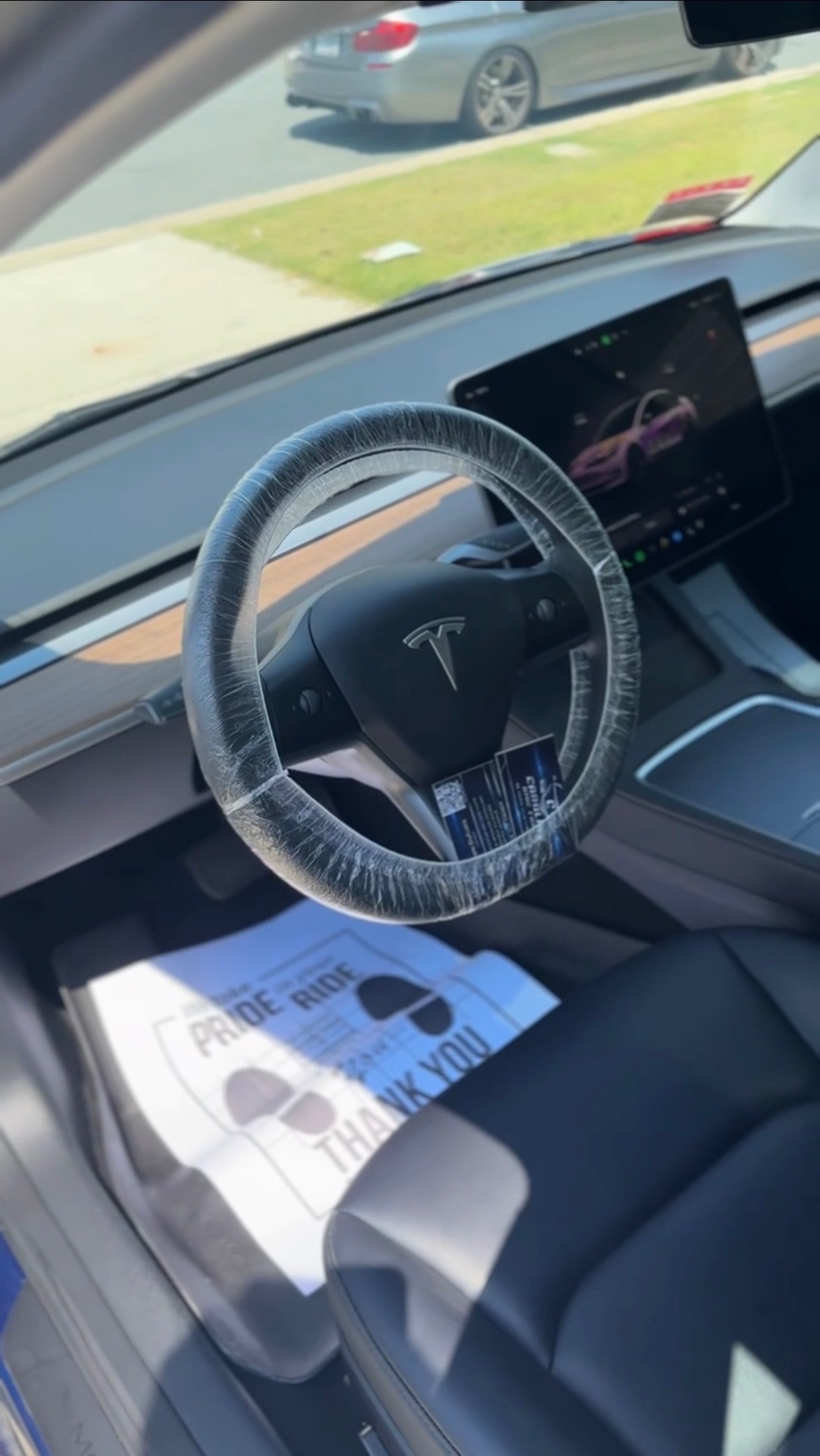 Tesla Model 3 interior after detailing — spotless cabin with protective covers
