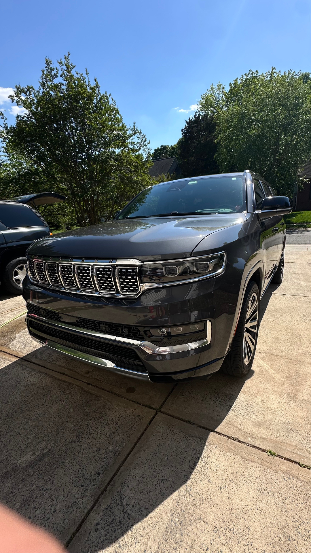 Exterior detailing — gleaming Jeep Grand Wagoneer after full detail